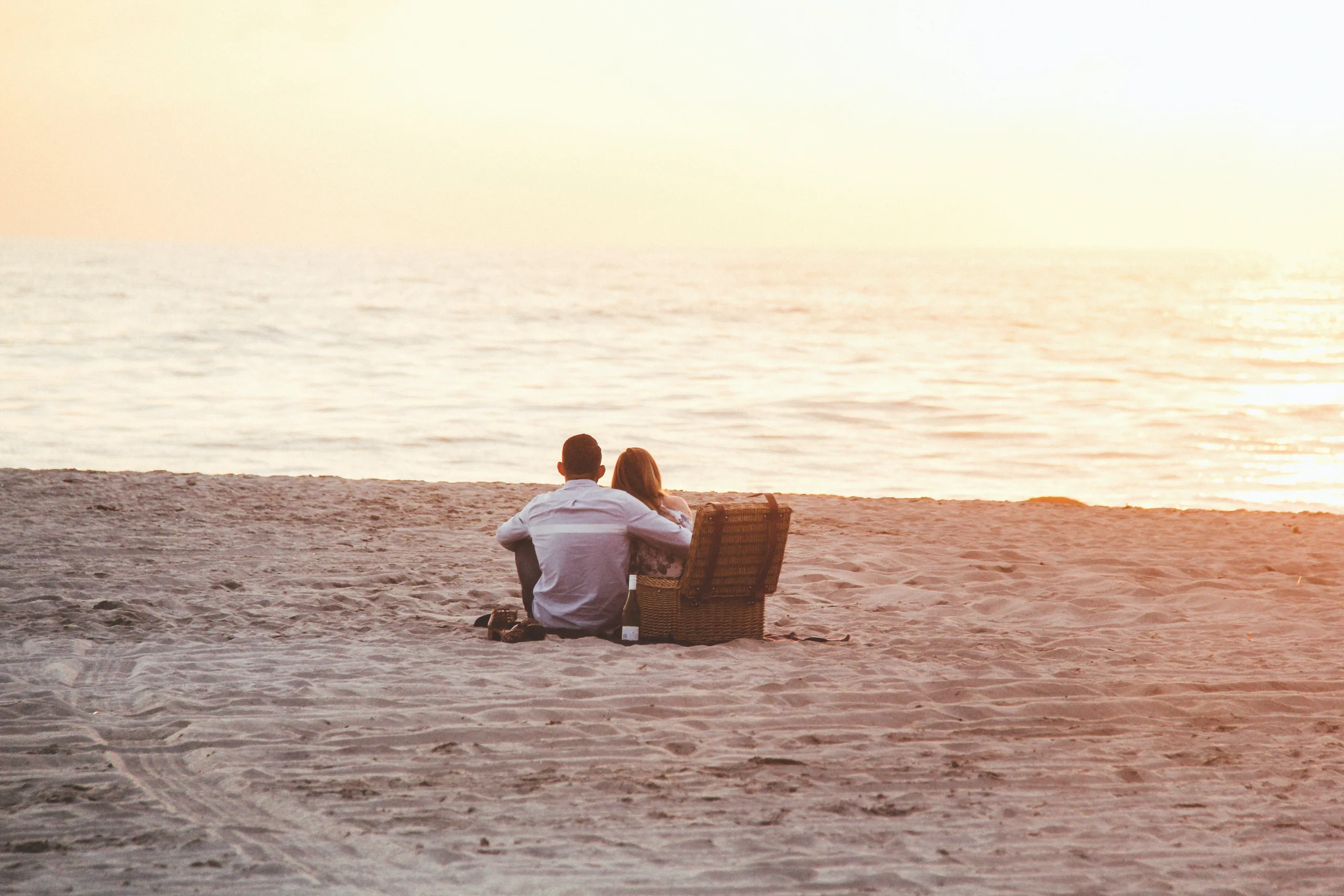 couple enjoying a picnic on the beach